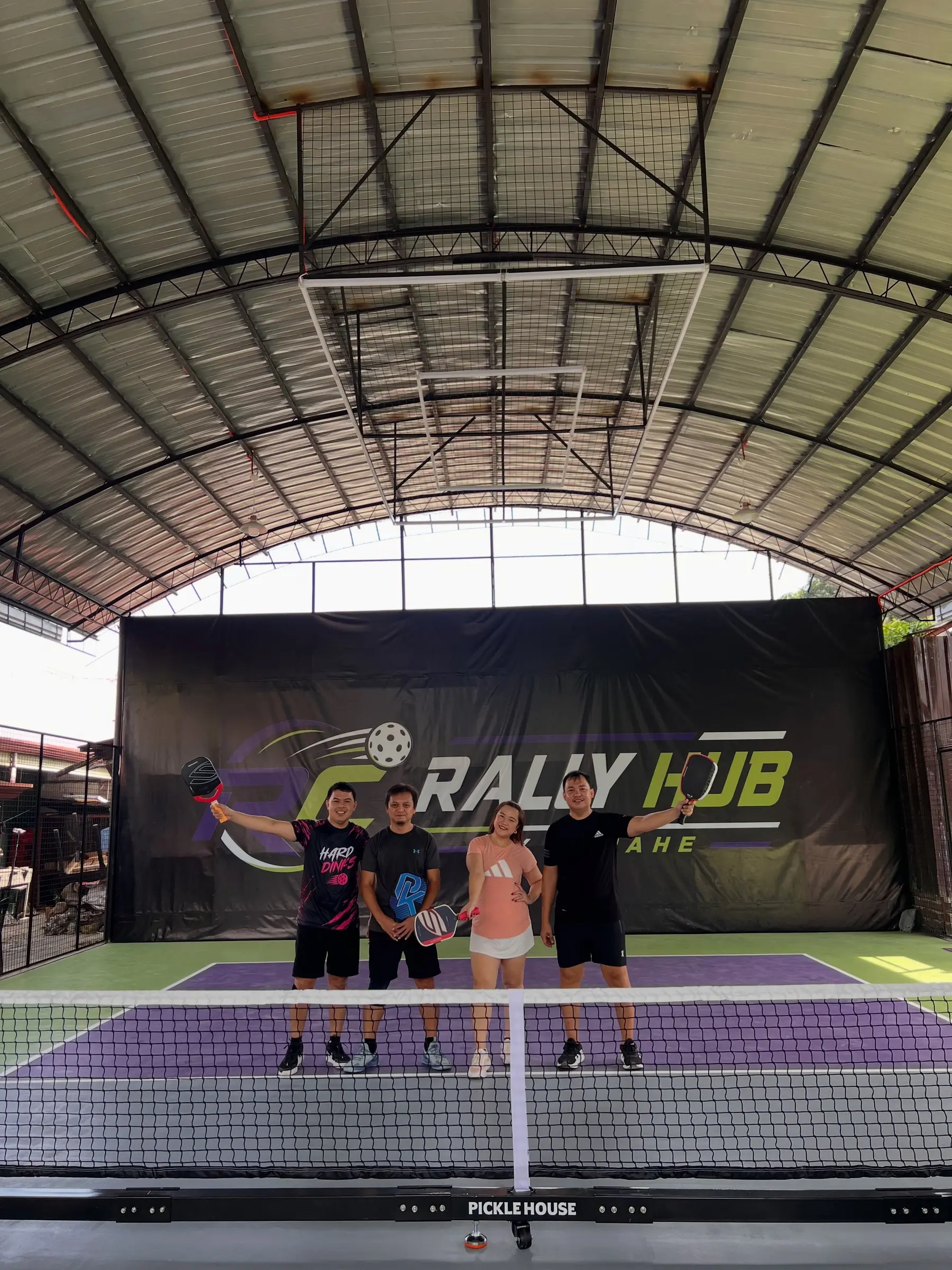 Players and spectators celebrating together during open play at RC Rally Hub